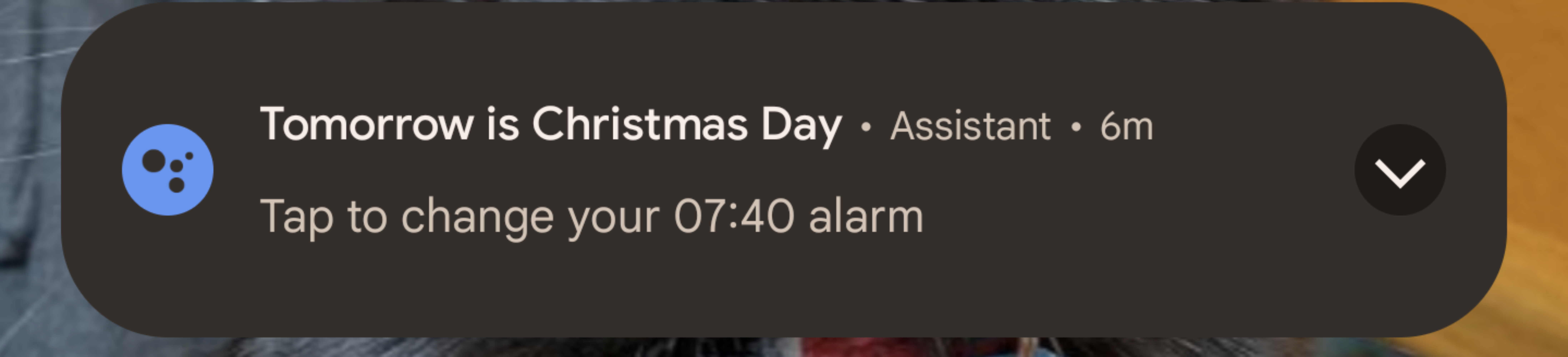 Screenshot of the Android lockscreen with a notification from Google Assistant showing "tomorrow is Christmas Day, change your alarm" despite the day today is the 26th of December, making tomorrow two days later
