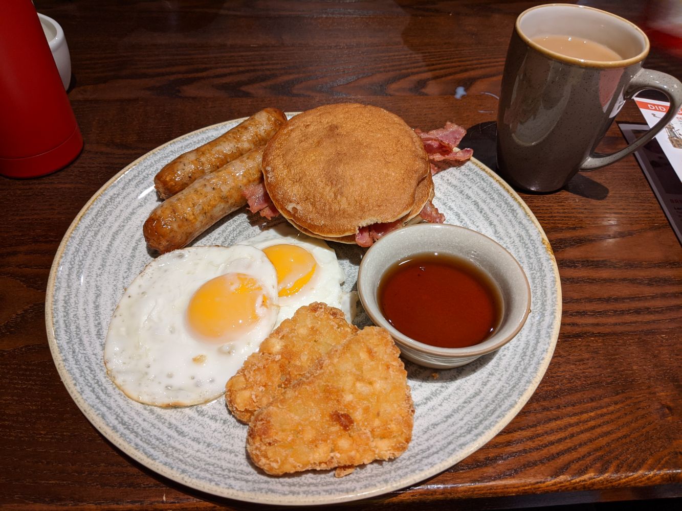 An "American breakfast" with bacon, sausages and pancakes