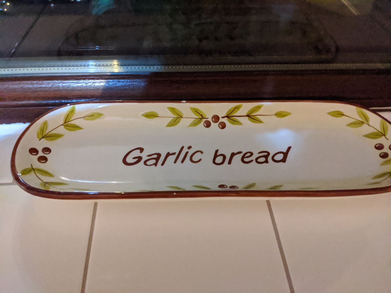 Serving tray with "garlic bread" written on it, referencing the 2016 meme Serving tray with "garlic bread" written on it, referencing the 2016 meme