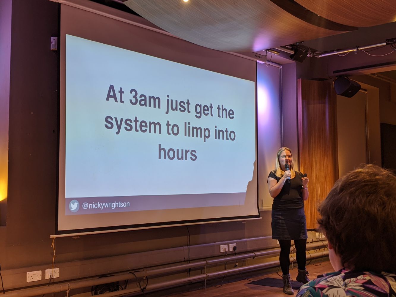 "at 3am just get the system to limp into hours" written on a slide "at 3am just get the system to limp into hours" written on a slide