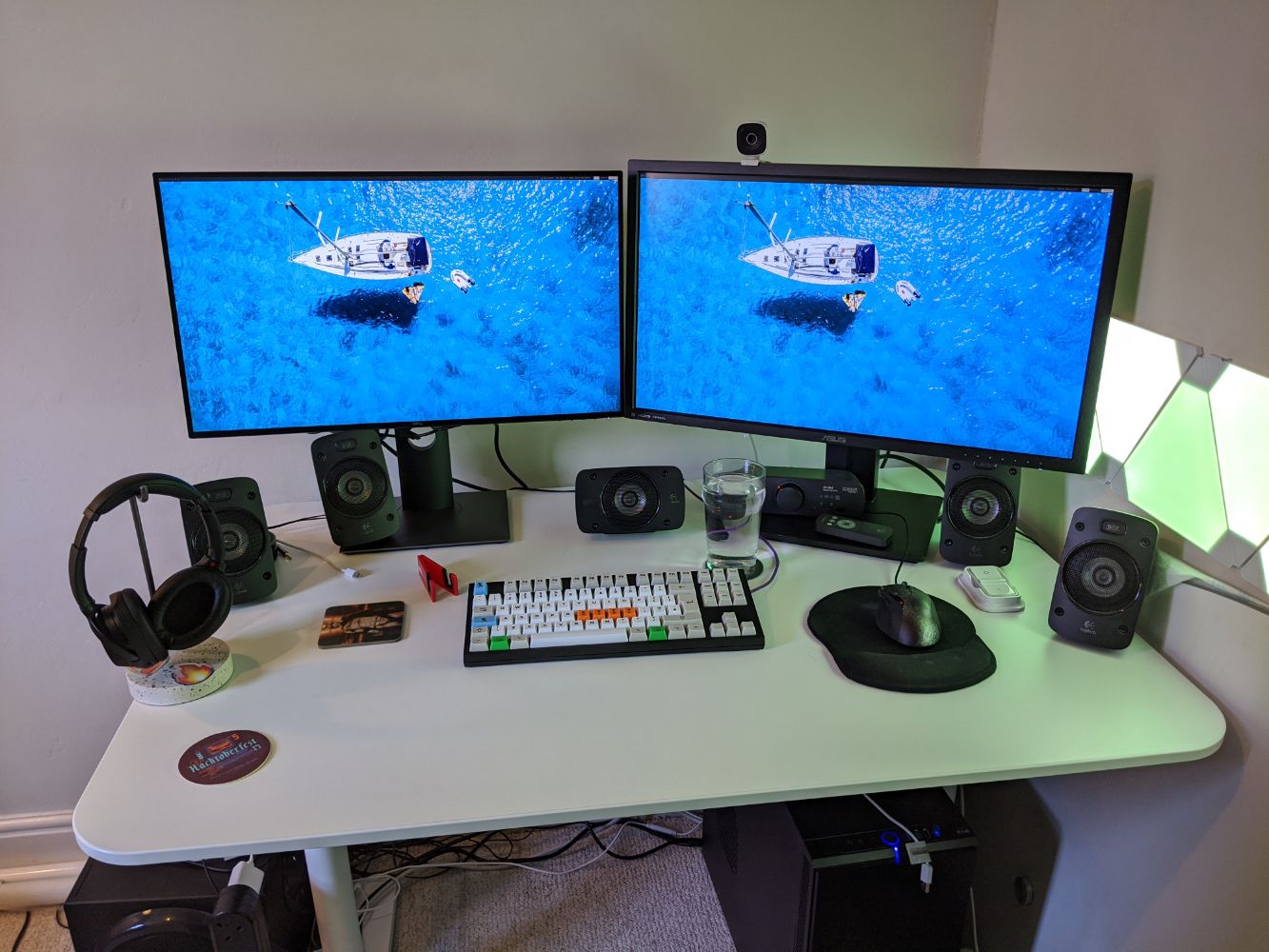 Two 27" 4K monitors plugged into Jamie's desktop, with a mechanical keyboard, and a fair bit of room on the desk